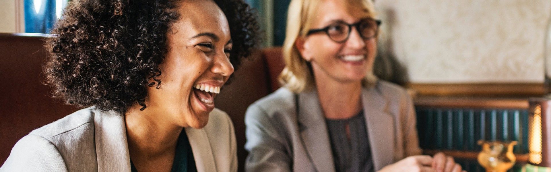 Two women talking and laughing