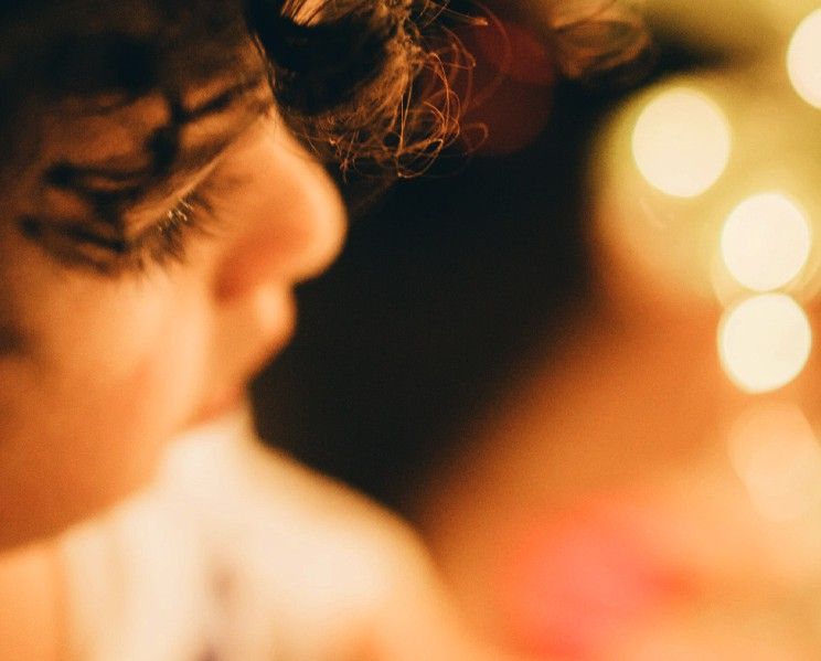 A young child and fairy lights