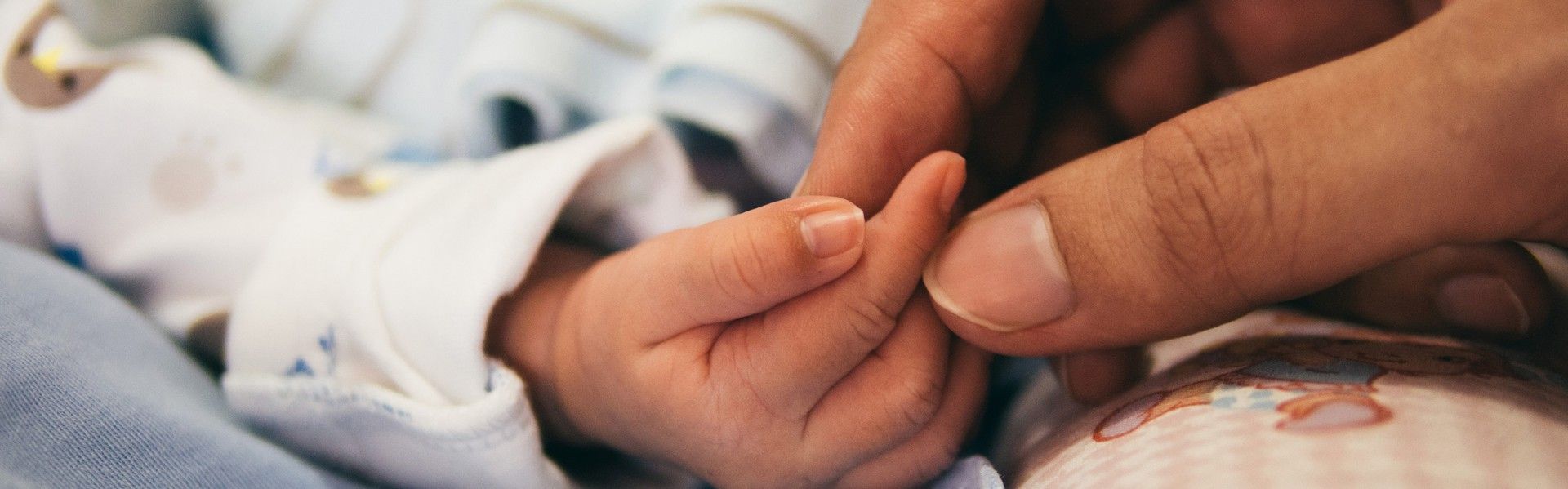 Mother and Baby holding hands