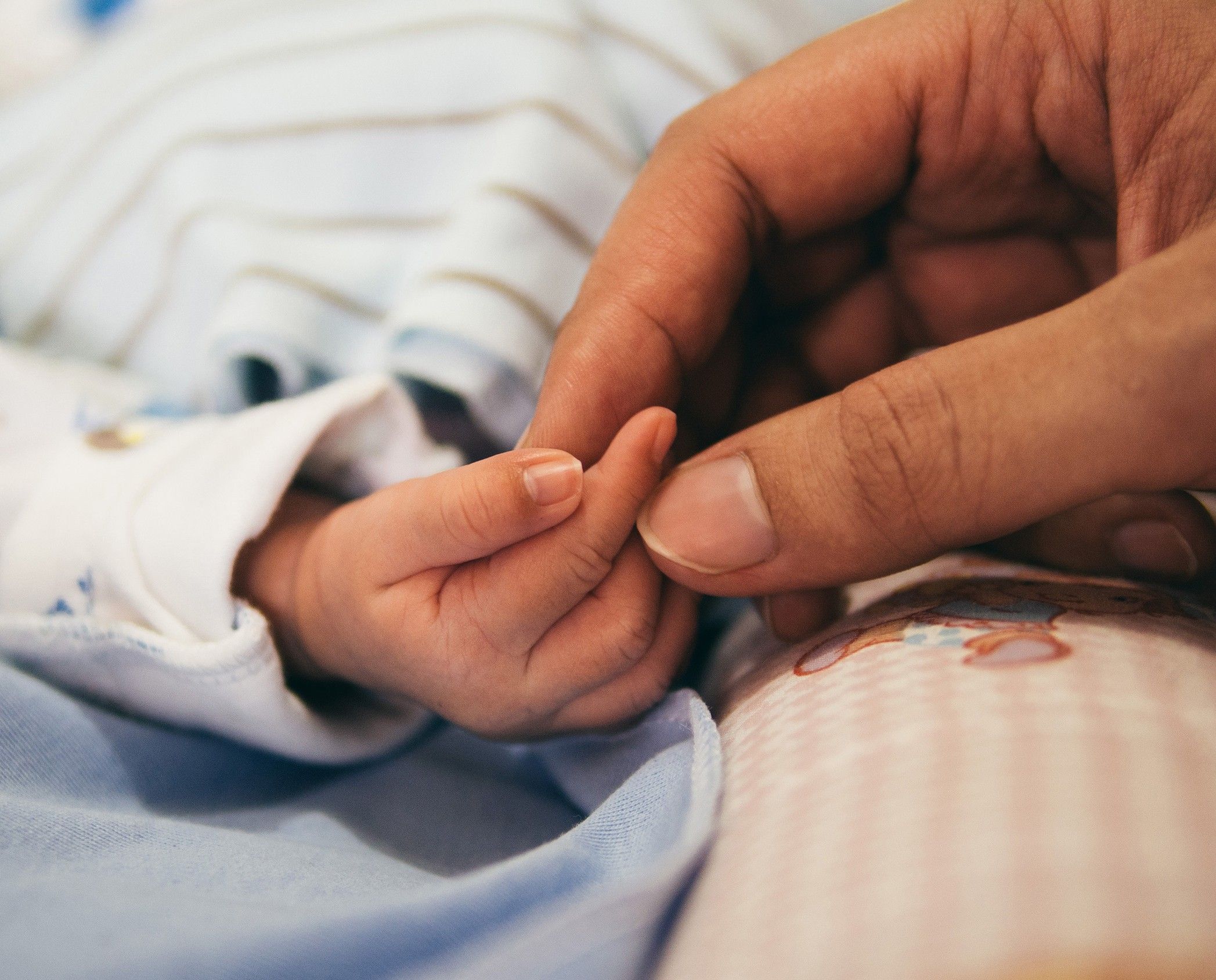 Mother and Baby holding hands