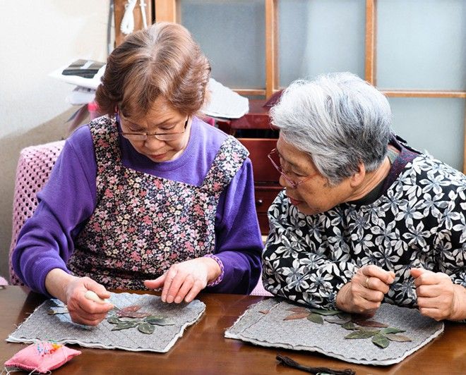 Two women sewing